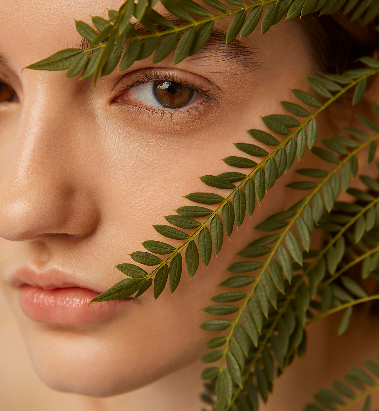 Close Up Woman Posing With Plant